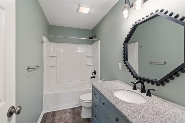 7912 N Poplar Ct, Kansas City, MO 64119 - full bath featuring vanity, toilet, wood finished floors, and shower / tub combination
