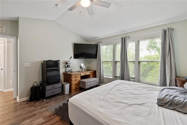 7912 N Poplar Ct, Kansas City, MO 64119 - bedroom with lofted ceiling, dark wood-type flooring, ceiling fan, and baseboards