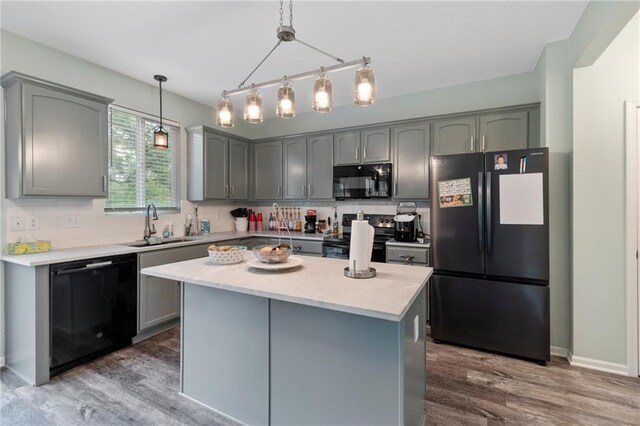 7912 N Poplar Ct, Kansas City, MO 64119 - kitchen featuring black appliances, gray cabinetry, a sink, and dark wood-type flooring