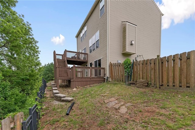 7912 N Poplar Ct, Kansas City, MO 64119 - view of property exterior featuring a fenced backyard, a wooden deck, and stairs