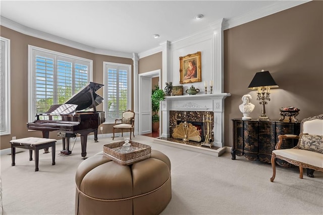 sitting room with carpet flooring, crown molding, baseboards, and a premium fireplace