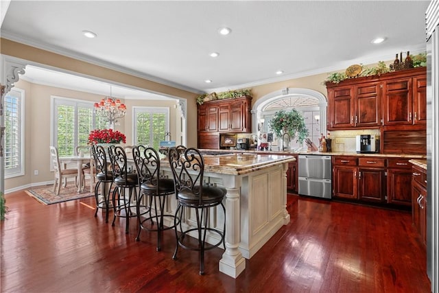 kitchen with a kitchen breakfast bar, dark wood-type flooring, backsplash, dishwasher, and a kitchen island