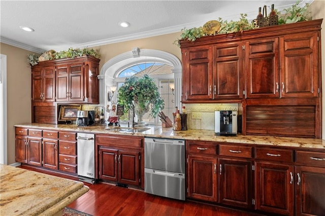 kitchen featuring a sink, light stone counters, dishwasher, dark wood-style flooring, and decorative backsplash