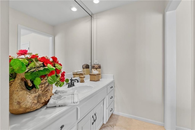 bathroom featuring tile patterned floors, baseboards, vanity, and recessed lighting