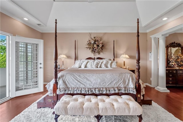 bedroom featuring recessed lighting, access to outside, ornate columns, and wood finished floors