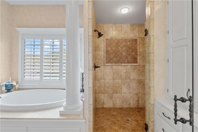 bathroom featuring a bath and a stall shower