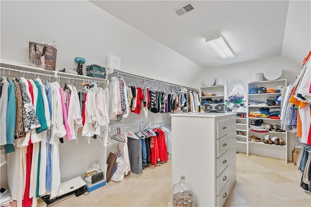 walk in closet featuring vaulted ceiling and visible vents