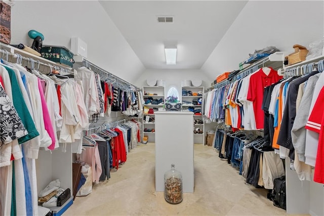spacious closet with lofted ceiling and visible vents