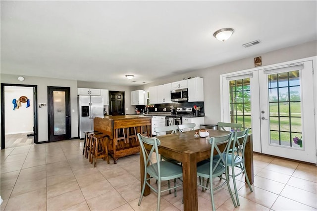 7934 SW James Lee Rd, Polo, MO 64671 - dining space with french doors and light tile patterned flooring