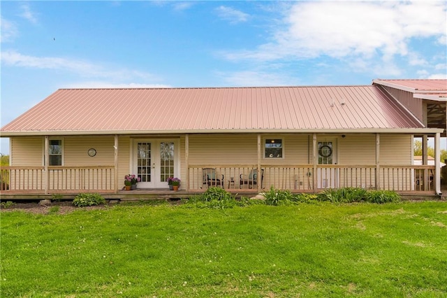 7934 SW James Lee Rd, Polo, MO 64671 - back of property with a yard, a metal roof, and french doors