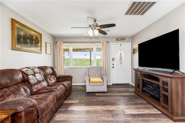 7934 SW James Lee Rd, Polo, MO 64671 - living room featuring dark wood-style floors and a ceiling fan