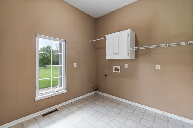 washroom with hookup for an electric dryer, visible vents, cabinet space, hookup for a washing machine, and light floors