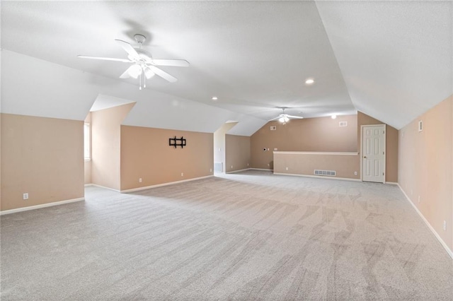 bonus room featuring a ceiling fan, baseboards, visible vents, and lofted ceiling