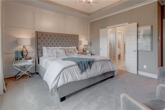 bedroom with crown molding, a notable chandelier, and light colored carpet