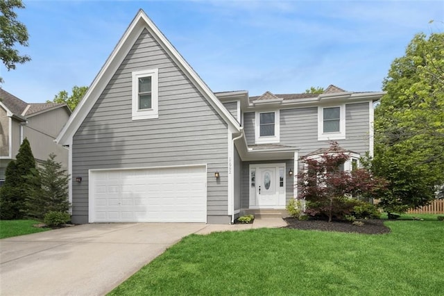 11992 S Rene St, Olathe, KS 66062 - traditional-style home featuring an attached garage, driveway, and a front yard