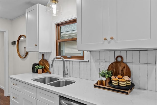 2521 W 47th Ter, Westwood, KS 66205 - kitchen with a sink, decorative backsplash, and white cabinetry