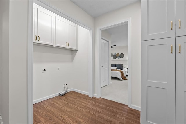 2521 W 47th Ter, Westwood, KS 66205 - laundry area featuring hookup for an electric dryer, cabinet space, wood finished floors, and baseboards