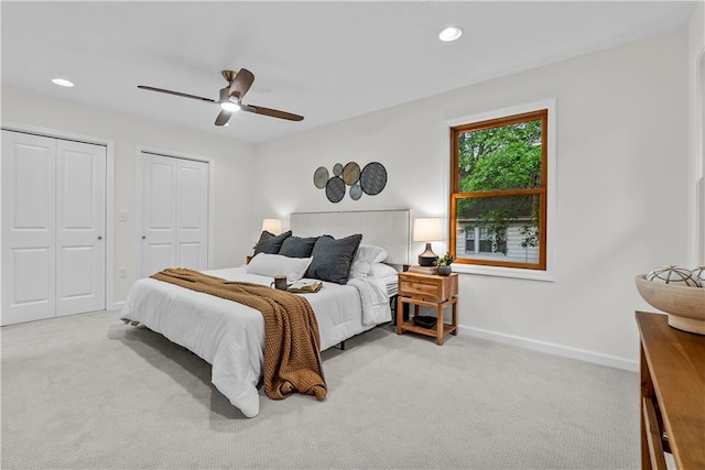 2521 W 47th Ter, Westwood, KS 66205 - bedroom with carpet flooring, multiple closets, baseboards, recessed lighting, and ceiling fan