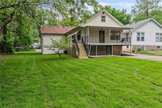 2521 W 47th Ter, Westwood, KS 66205 - rear view of property with stairway, a lawn, a deck, and cooling unit