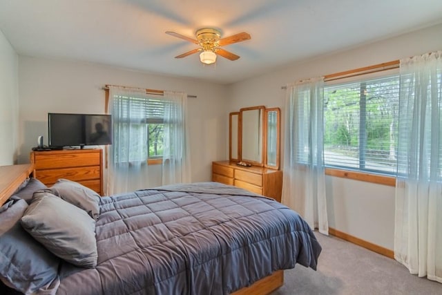 23801 Evans Rd, Tonganoxie, KS 66086 - bedroom with multiple windows, carpet, baseboards, and ceiling fan