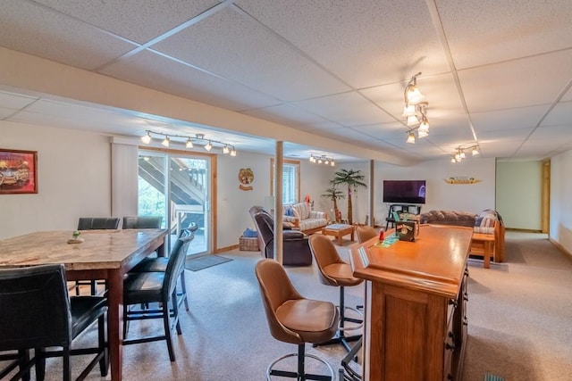 23801 Evans Rd, Tonganoxie, KS 66086 - carpeted dining space with a paneled ceiling and baseboards