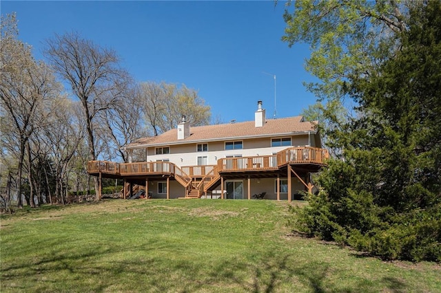 23801 Evans Rd, Tonganoxie, KS 66086 - rear view of property featuring stairway, a deck, a lawn, and a chimney