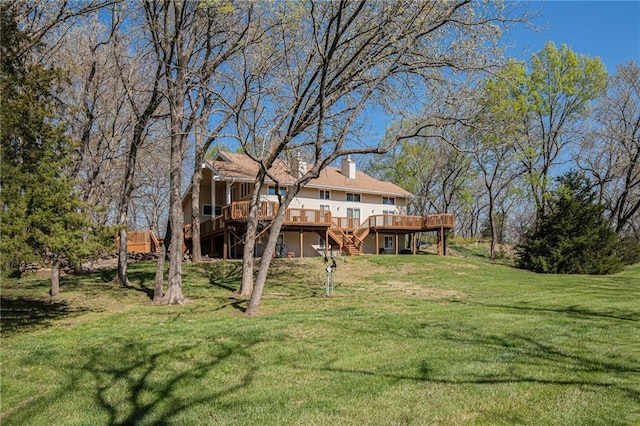23801 Evans Rd, Tonganoxie, KS 66086 - view of grassy yard featuring stairs and a wooden deck