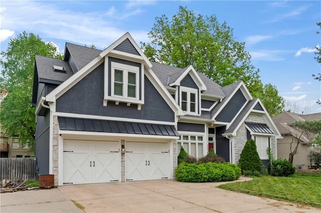 4504 NE 60th Ter, Kansas City, MO 64119 - craftsman inspired home with a standing seam roof, driveway, a garage, a shingled roof, and stone siding