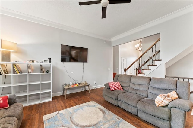 4504 NE 60th Ter, Kansas City, MO 64119 - living room with crown molding, stairs, wood finished floors, baseboards, and ceiling fan with notable chandelier