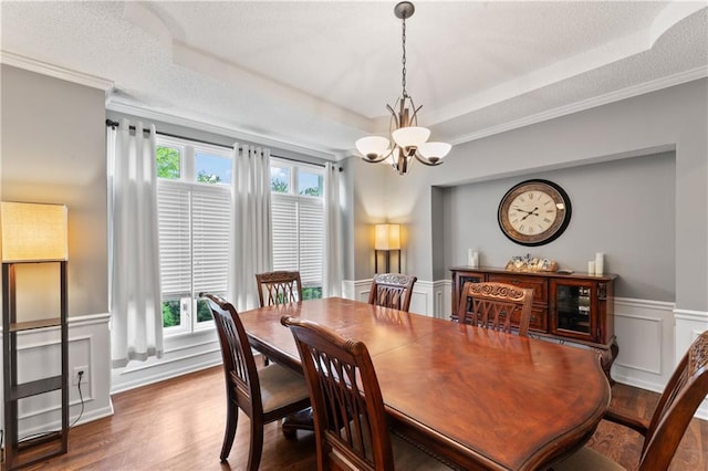 4504 NE 60th Ter, Kansas City, MO 64119 - dining area with a raised ceiling, wood finished floors, and a chandelier