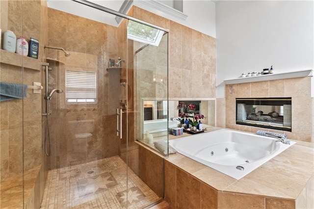 4504 NE 60th Ter, Kansas City, MO 64119 - bathroom with a tub with jets, a shower stall, and a healthy amount of sunlight