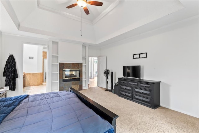 4504 NE 60th Ter, Kansas City, MO 64119 - bedroom with ornamental molding, a fireplace, baseboards, a raised ceiling, and carpet flooring