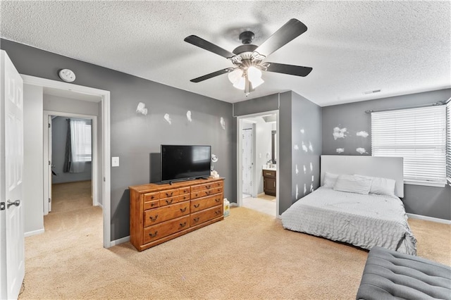 4504 NE 60th Ter, Kansas City, MO 64119 - bedroom with baseboards, light carpet, a textured ceiling, and visible vents