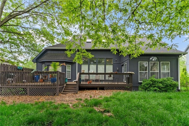 4504 NE 60th Ter, Kansas City, MO 64119 - back of house with a deck and a shingled roof