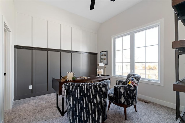 interior space featuring baseboards, carpet flooring, visible vents, and ceiling fan