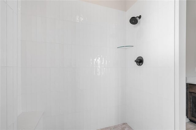 bathroom with a tile shower