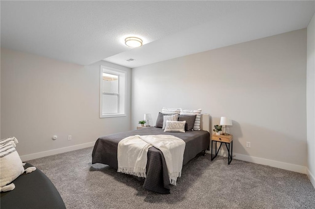 carpeted bedroom featuring baseboards