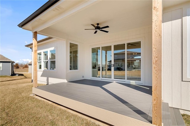 view of patio / terrace with ceiling fan and a deck