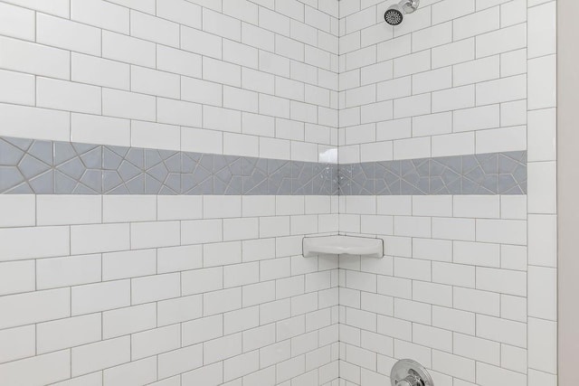 full bath with tiled shower