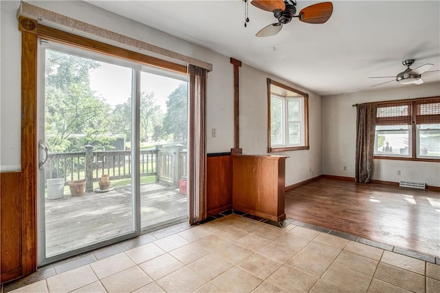2806 S Whitney Ave, Independence, MO 64057 - empty room with ceiling fan and light tile patterned flooring