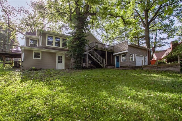 2806 S Whitney Ave, Independence, MO 64057 - rear view of house with stairway, a wooden deck, central AC unit, and a yard