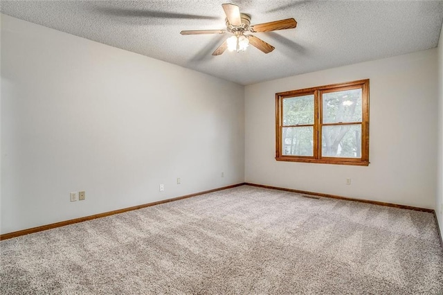 4008 NW 75th St, Kansas City, MO 64151 - spare room with carpet floors, a ceiling fan, baseboards, and a textured ceiling