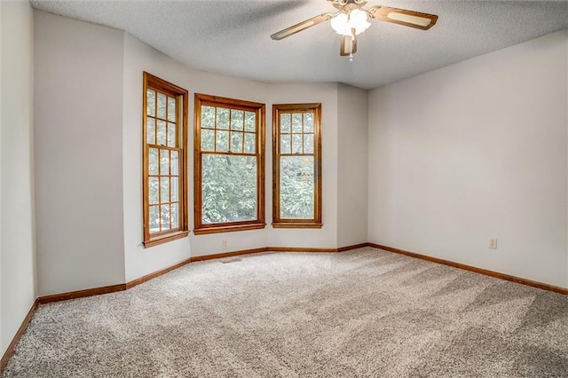 4008 NW 75th St, Kansas City, MO 64151 - carpeted spare room featuring a textured ceiling, baseboards, and ceiling fan