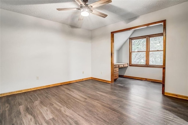 4008 NW 75th St, Kansas City, MO 64151 - unfurnished room featuring wood finished floors, a ceiling fan, baseboards, a textured ceiling, and vaulted ceiling
