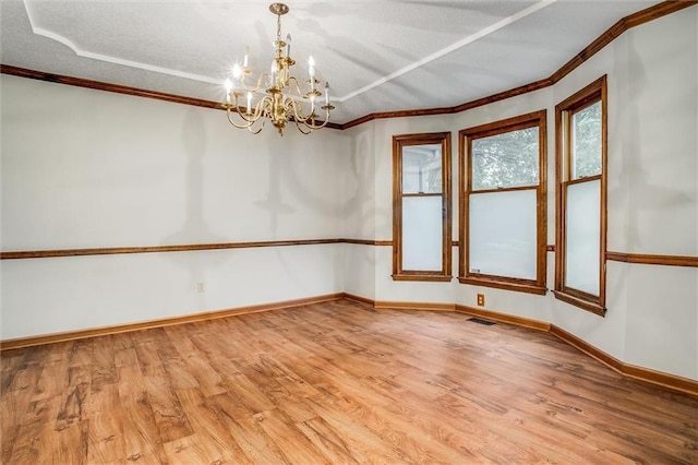 4008 NW 75th St, Kansas City, MO 64151 - spare room with light wood-type flooring, crown molding, a chandelier, baseboards, and a textured ceiling