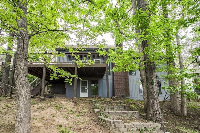 4008 NW 75th St, Kansas City, MO 64151 - back of house featuring a deck and stairway