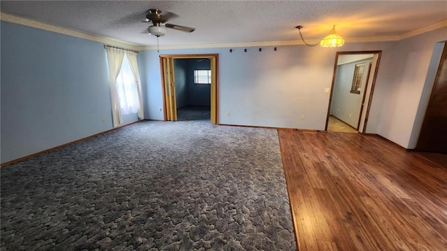 2704 S Taylor St, Pittsburg, KS 66762 - empty room featuring ornamental molding, a ceiling fan, wood finished floors, and a textured ceiling