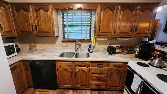 2704 S Taylor St, Pittsburg, KS 66762 - kitchen with white appliances, light countertops, and brown cabinets