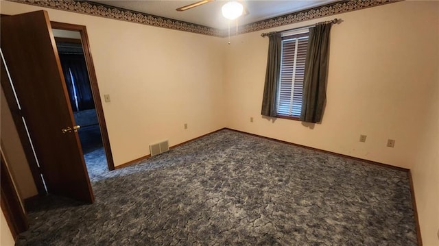 2704 S Taylor St, Pittsburg, KS 66762 - unfurnished room with a ceiling fan and dark colored carpet