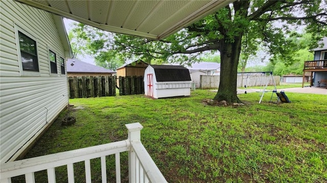 2704 S Taylor St, Pittsburg, KS 66762 - fenced yard featuring a shed